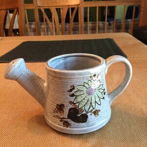 Small Pottery Watering Can Planter with a Flowers on it